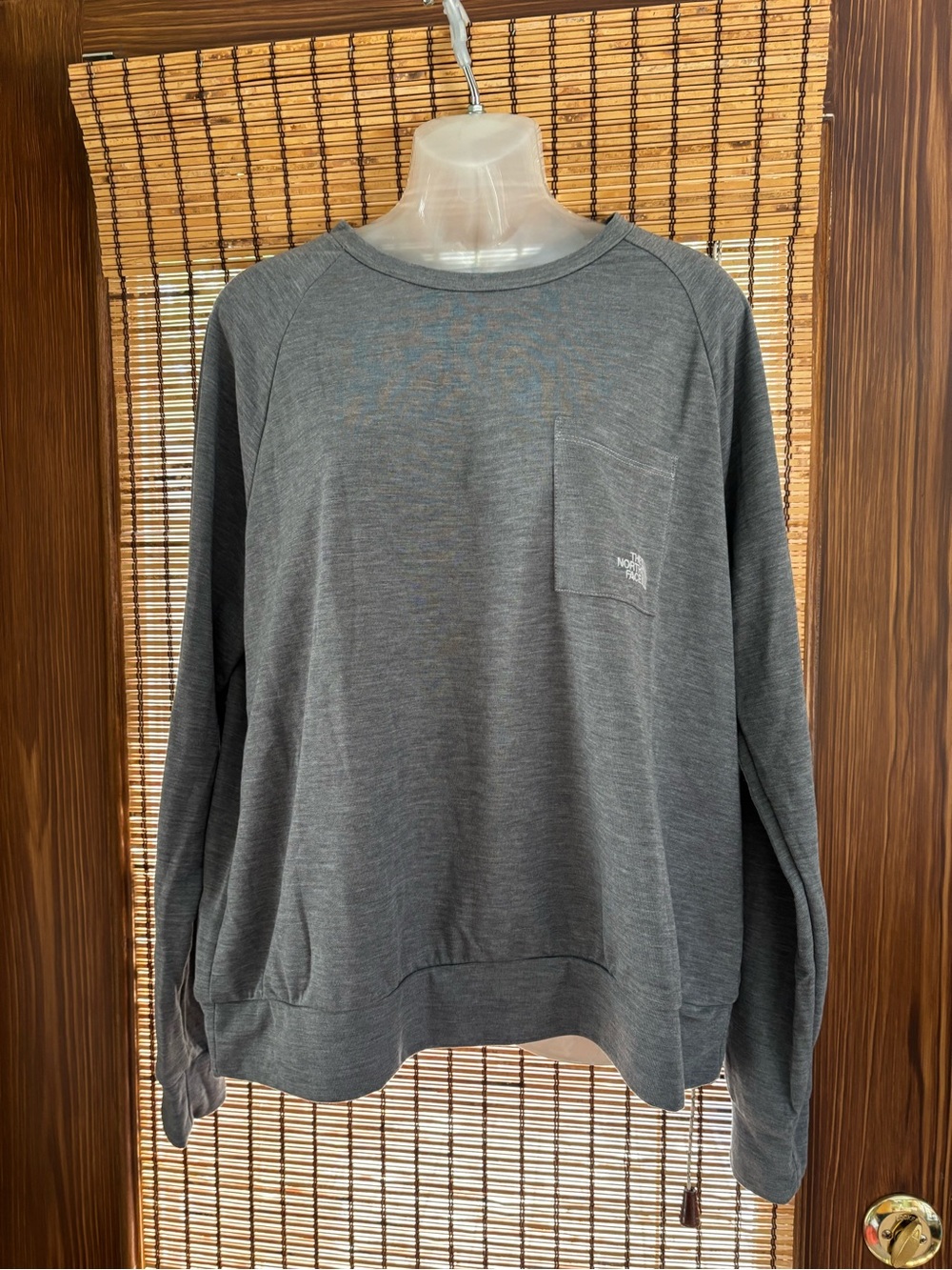 The North Face women’s  Gray Crewneck lightweight Top with Chest Pocket